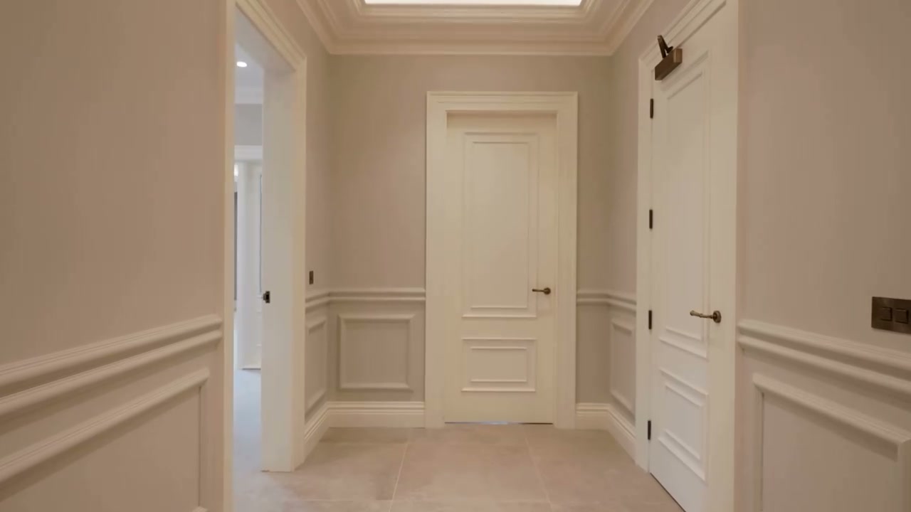 Phantom presenter-led property film still with an estate agent piece to camera at The Courtyard, Ardavon Estate apartments in Cultra
