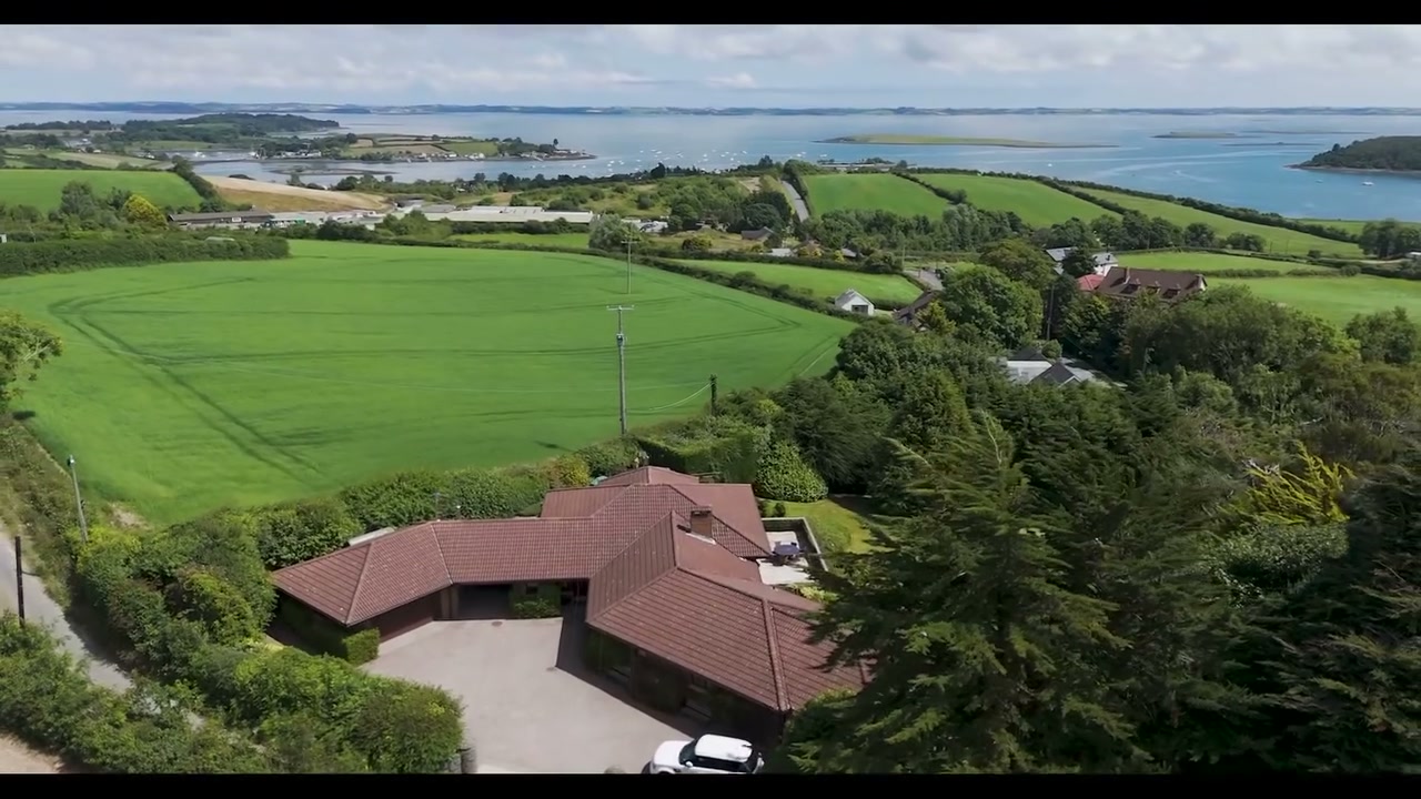 Aerial Phantom drone film still of a country home set in open countryside near Killinchy and Strangford Lough in summer